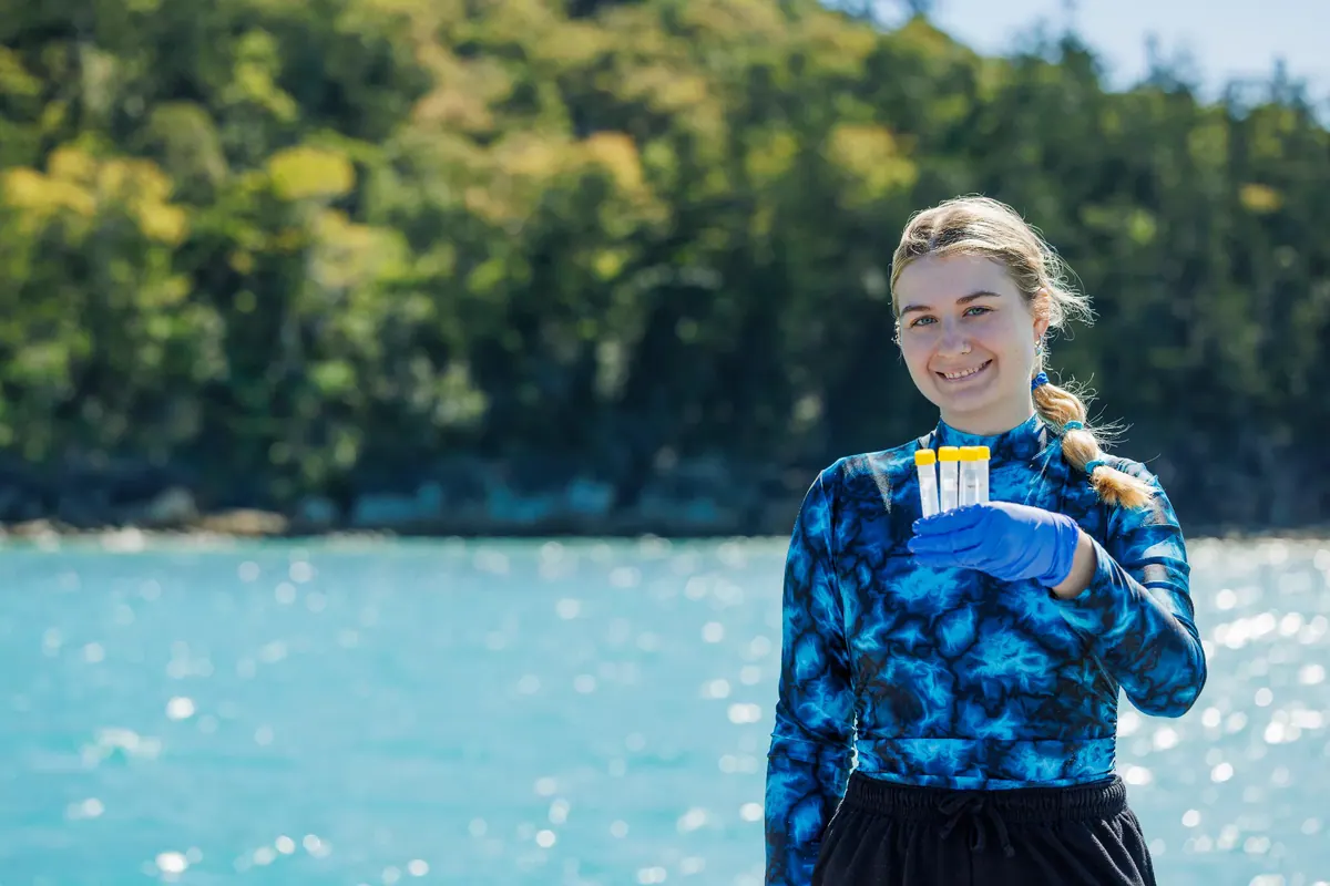 Holding up marine water samples collected for Project Blueprint